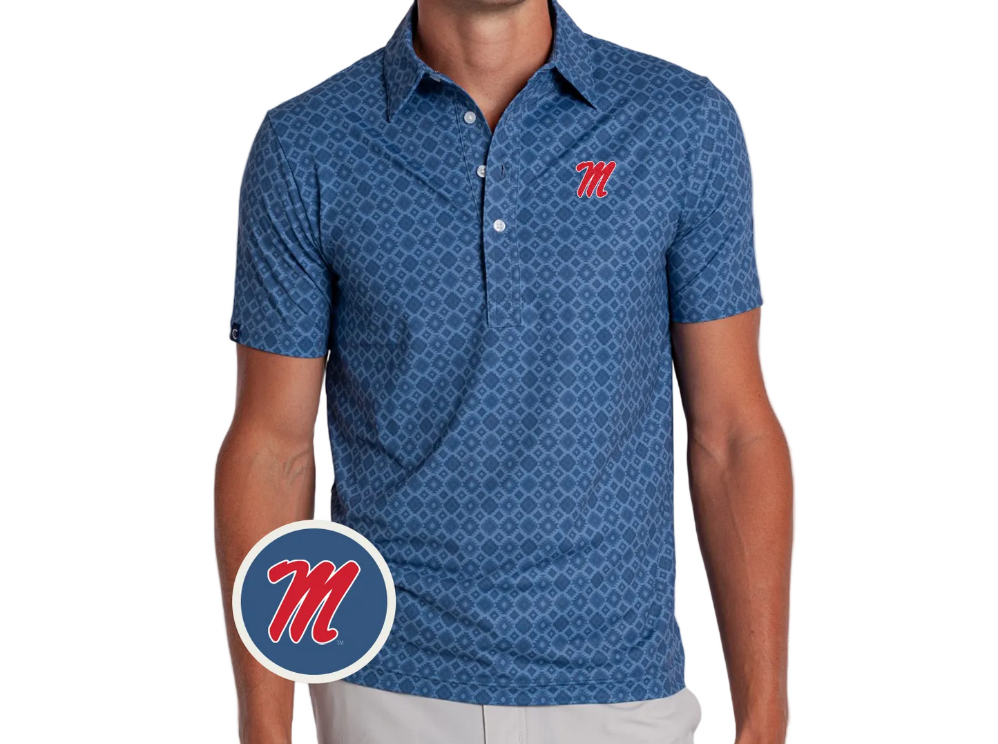 A man wearing a blue short-sleeve polo shirt with a repeating geometric pattern and a red script Ole Miss 'M' logo on the left chest. A circular inset logo showing the red 'M' on a blue background is overlaid near the bottom left.